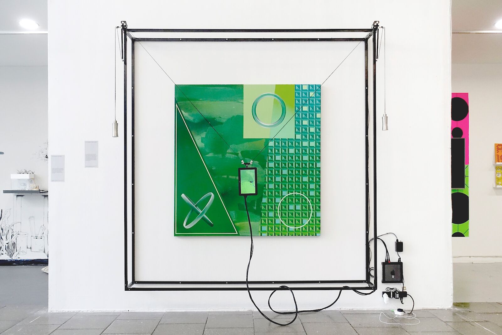 Charismatic Megapigment, Tobias Revell with Wesley Goatley and Charley Peters, 2019. Installation of a robot trained on 125,000 images drawn from a Google image search of the word ‘green’running a nearest-neighbour match on a painting by Charley Peters.